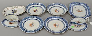 Nine piece group of Armorial export porcelain including two shaped gravy boats and underplates, two bowls, two plates, and one recta...