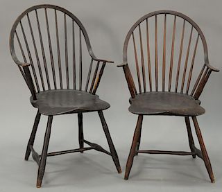 Pair of Continous Windsor armchairs with saddle seats in old brown paint. 
ht. 36 in.; seat ht. 17 in.