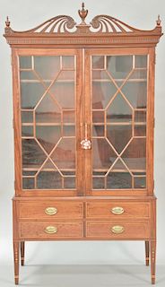 Margolis mahogany china cabinet in two parts, upper portion having pierce carved top over two glazed doors on lower portion with two...