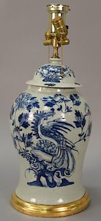 Large blue and white phoenix bird jar having celadon ground with painted phoenix bird amongst blossoming flowers made into a table l...
