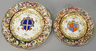 Set of thirteen capo-di-monte porcelain plates with centered armorials comprising of nine dinner plates and four luncheon. 
dia. 8 1...