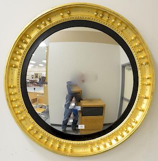 Federal circular convex mirror having deep gilt frame with black liner surround, circa 1800 (several decorative balls missing). 
tot...