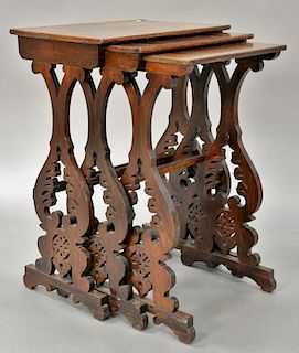 Nest of three rosewood Victorian tables with pierce carved ends.
ht. 28 1/2 in.; wd. 19 1/2 in.; dp. 13 in.; top: 13 1/2" x 19 1/2"