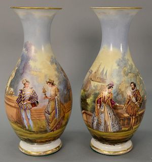 Pair of porcelain vases painted with romantic scenes and gilt highlights (crack at top). ht. 16 1/2 in.