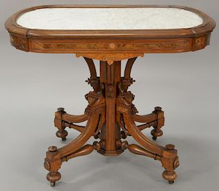 Victorian walnut marble top table with inset marble. 
ht. 29 1/2 in.; top: 25" x 37"