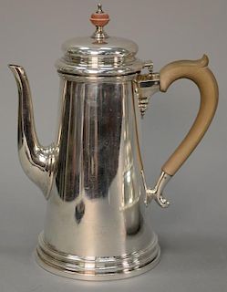 James Robinson English silver lighthouse teapot with wood handle and finial. 
ht. 9 1/2 in.; 36.5 t oz.
