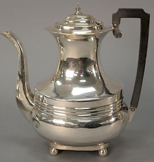 English silver tea pot on ball feet with wood handle. 
ht. 8 3/4 in.; 19 t oz.