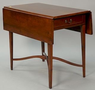 Federal cherry Pembroke drop leaf table with drawer set on square tapered legs joined by arched stretcher, circa 1790. 
ht. 28 in.; ...