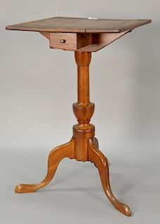Federal cherry candlestand having square top with molded edge over one drawer over turned urn shaft with cabriole legs on pad feet....