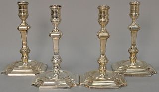 Set of four English silver candlesticks with turned and square shafts on modified square bases. ht. 8 1/4 in.; 81 t oz.