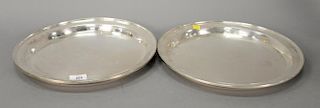 Pair of Cartier sterling silver deep serving trays signed Cartier 2814. 
dia. 14 in.; 68.7 t oz.