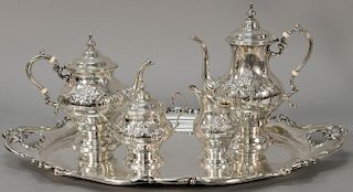 Gorham sterling silver tea and coffee set with matching two handled trays, no monogram. 
pot: ht. 11 in. 
tray: lg. 25 1/4 in. 
195....