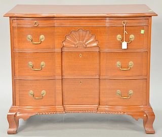 Margolis mahogany block front chest with blocked top over conforming slide and three drawers all set on ogee feet with gardrooned ce...