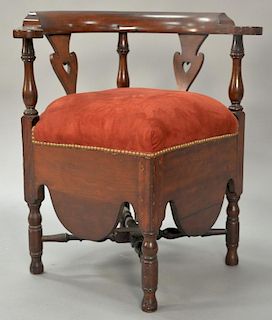 Mahogany corner chair with heart carved splats, upholstered seat, and turned legs and stretchers. 
ht. 31 in.