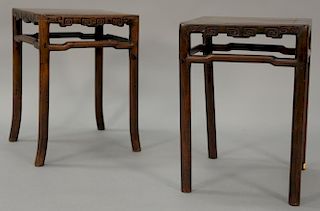 Pair of Qing Dynasty side tables with carved sides and round turned legs (one table with spliced legs). ht. 20 1/2 in.; top: 14 1/4...