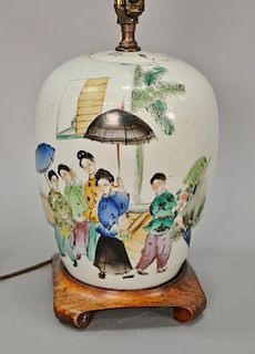 Oriental porcelain ginger jar with painted scene having girls with umbrellas and characters on back. 
jar ht. 10 in.