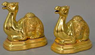 Pair of sterling silver camels, each gilt decorated and with small covers on top, each mounted on gilt wood fitted bases, marked 925...