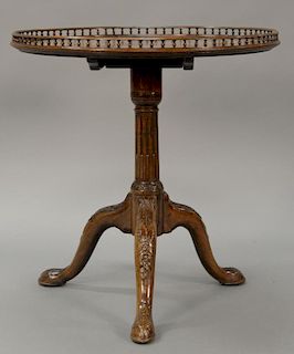 George III mahogany tip top table with gallery top (gallery as is). 
ht. 29 in.; top dia. 28 in.