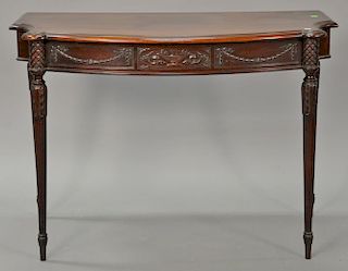 Custom mahogany one drawer serving table with shaped top over drawer with carved urn on reeded legs. 
ht. 30 in.; top: 42" x 22"