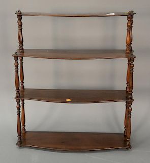 Mahogany four tier hanging shelf, 19th century. 
ht. 27 1/2 in.; wd. 24 in.