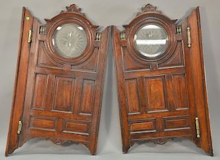 Pair of walnut Victorian tavern double swing doors with round glass inserts and brass turnings. 
door ht. 46 in.; wd. 28 1/2 in.