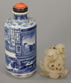Two piece lot including Chinese blue and white snuff bottle with painted interior scene and coral top along and a carved hardstone f...