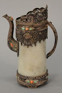 Tibetan turquoise and coral mounted pitcher having hardstone body with silver handles, spout, and rim.  
ht. 5 3/4 in.