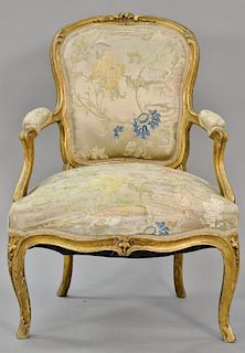 Louis XV fauteuil with gilt frame and old silk upholstery (upholstery as is). 
seat ht. 15 in.
