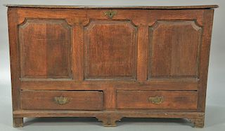 George III oak chest with rectangular lift top over three raised panels over two drawers on plain feet, 18th century. 
ht. 35 in.; w...