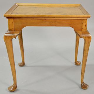 Queen Anne maple tea table having molded rectangular top on plain skirt set on cabriole legs ending in pad feet, 18th century (refin...