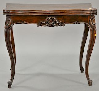 Victorian rosewood game table with cabriole legs and carved shell front having top opening to reveal felt interior. ht. 29 1/2 in.;...