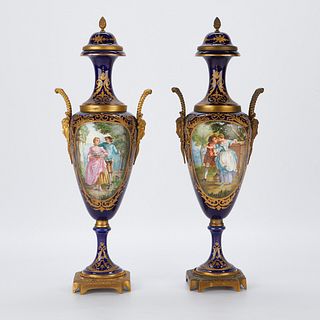 Pair of French Sevres Style Urns w/ Mask Handles