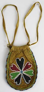 Small Makota type bead decorated small hide bag. Floral pattern. 5"l x 3"w.
