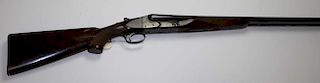 Winchester Model 21 double barrel 12 gauge shotgun. Full & mod choke. 30" barrel. High grade walnut