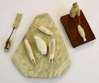 3 Inuit carved walrus tusk figures- hunter w/ seal, dog & dogsled, group of seals & walrus (incomple