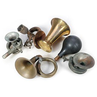 Four Antique Bicycle Squeeze Bulb Horns and a Brass Megaphone