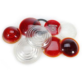 Three Clear and Five Red Glass Lenses including one that reads Hudson 8