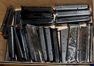 24 magazines for various pistols 9mm, 45 cal, .22 etc
