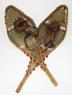 late 19th c pr of snowshoes w/ red tufts of wool to simulate moose hair, probably Canada or Vermont,