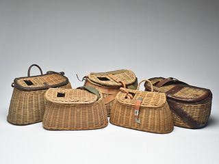 A collection of five wicker basket creels.