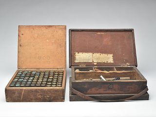 Two wooden shooting boxes with brass shells and loading tools, early 20th century.