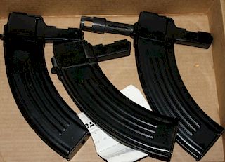 three 30 round magazines and a recoil compensator for SKS rifle