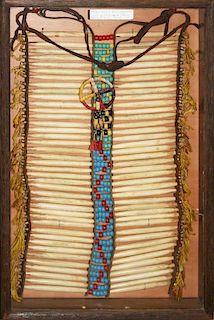 Plains Indian hairbone breastplate w/ quilled wheel decoration (ex Robt Breeding collection), 18” x