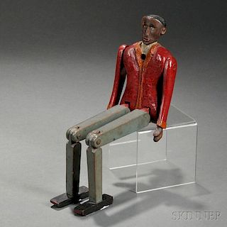 Carved and Painted Articulated Figure of a Black Man