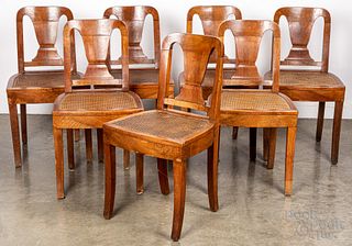 Set of seven French walnut cane seat dining chairs