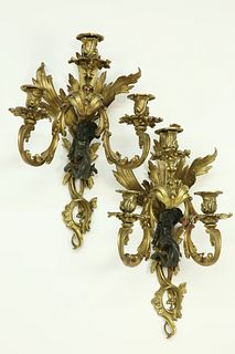 Pair of Louis XV Style Patinated and Gilt Bronze Three Light Bras de Lumiere, 19th Century