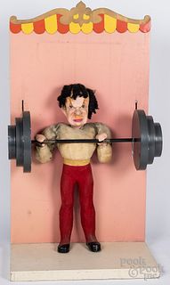 Kauffman's animated weight lifter store display