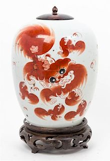 An Iron Red Decorated Porcelain Jar and Cover Height 15 inches overall.