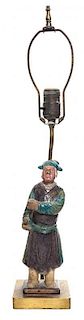 * A Purple and Turquoise Glazed Pottery Figure of a Man Height of figure 10 1/2 inches.