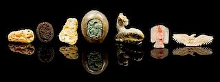 * Seven Carved Hardstone Toggles Height of largest 1 3/4 x width 2 1/4 x depth 3 1/4 inches.